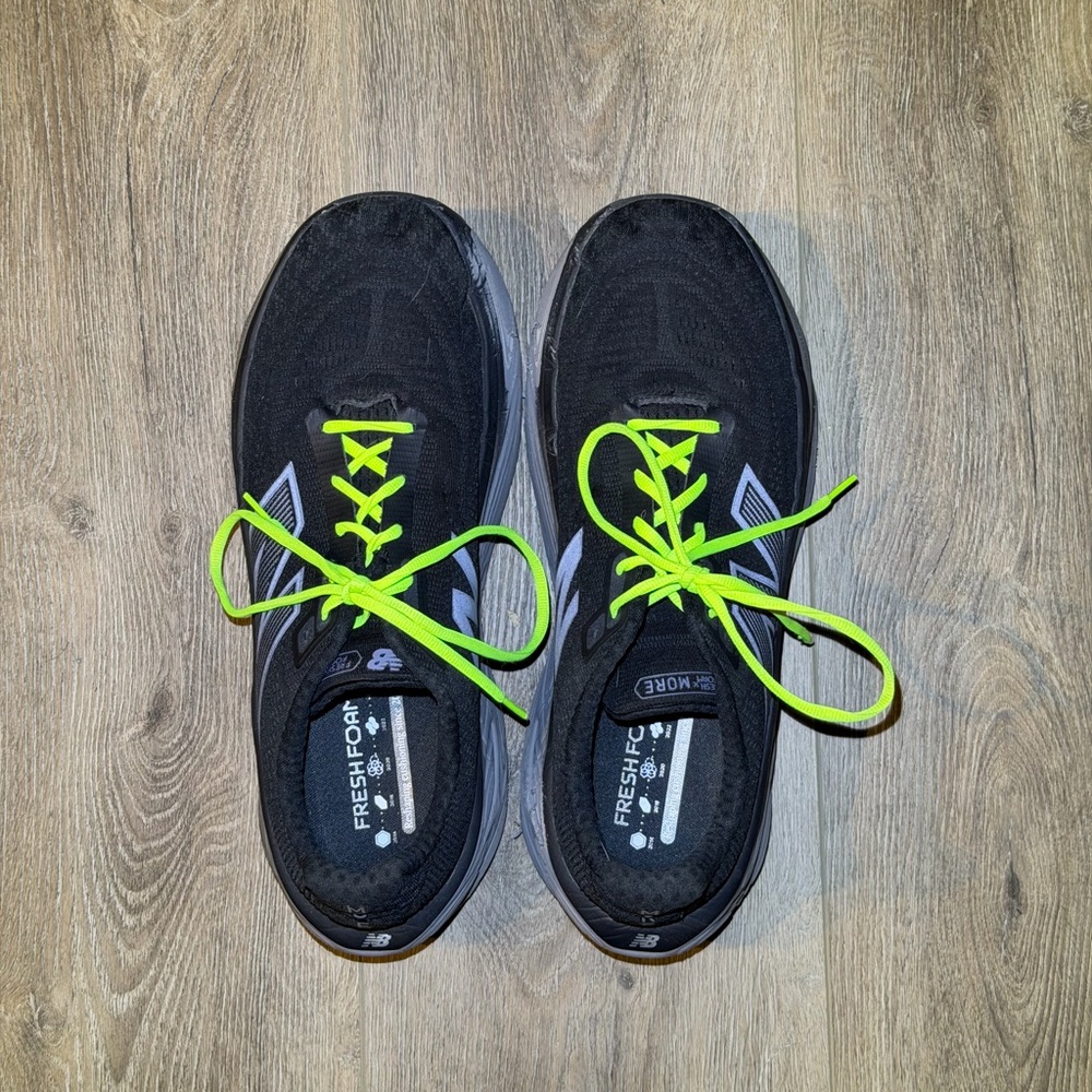 Black size 16 men's New Balance sneakers